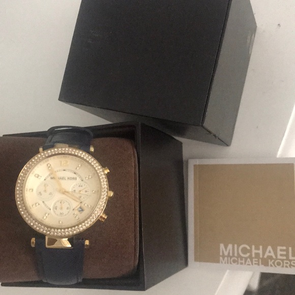 Blue leather Michael kors watch with diamonds.